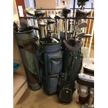 Quantity of golf clubs and three bags