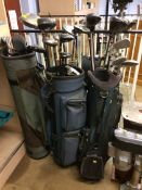 Quantity of golf clubs and three bags