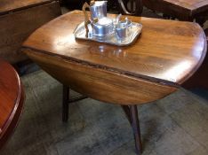 An Ercol drop leaf dining table
