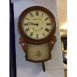 A mahogany drop dial wall clock