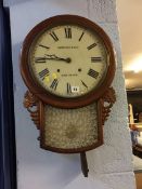 A mahogany drop dial wall clock
