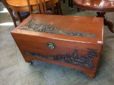 A camphor lined Oriental carved blanket box
