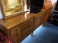 An oak chest of drawers and dressing table, together with a teak bureau