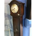 An oak cased Granddaughter clock