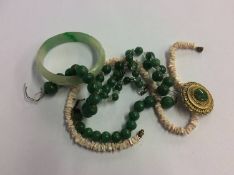 A jade bangle, necklace etc.