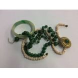 A jade bangle, necklace etc.