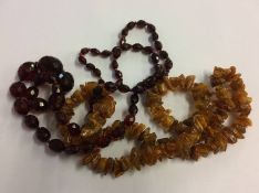 Amber coloured necklace and one other (2)