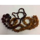 Amber coloured necklace and one other (2)