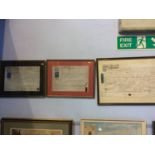 A collection of three framed indentures