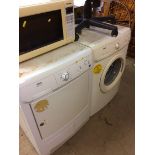 A Zanussi washer, dryer, Panasonic microwave and an office chair