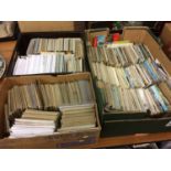 Three trays of postcards