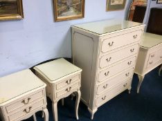 A cream Marie Antoinette style bedroom suite, comprising chest of drawers, dressing chest and a pair
