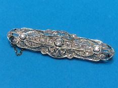 A diamond encrusted white metal brooch, central stone approx. 0.03ct