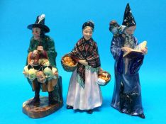 Three Royal Doulton figures 'The Wizard', 'The Orange lady' and 'Mask seller'