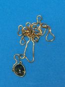 An 18ct gold chain with hardstone pendant