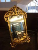 An Art Nouveau style easel mirror