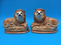 A pair of Victorian Staffordshire lions