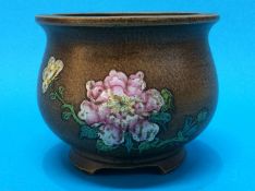 A Chinese famille rose pot, marks to base, 9cm high