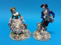 Two German porcelain figures of a gallant and a lady, marks in underglaze blue