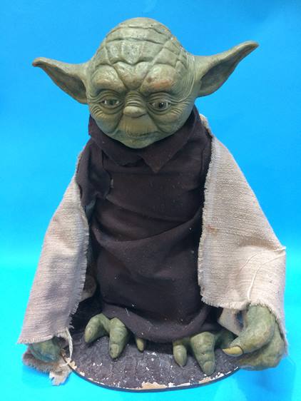 A latex model of Yoda, 65cm high