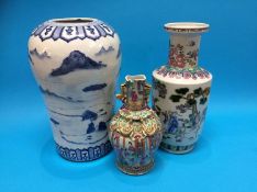 A Chinese canton enamel vase, a large Chinese blue and white vase and another (3)