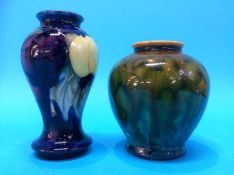 A small Moorcroft vase decorated with fruit, impressed marks, 10cm high and a small Linthorpe