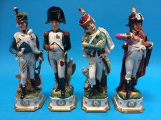 A set of four Continental porcelain figures of soldiers.