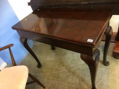 A Georgian mahogany fold over card table, with turned legs ending in pad feet, 91cm wide