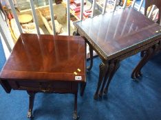 A reproduction mahogany gateleg occasional table and a mahogany nest of tables