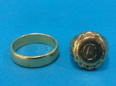 A 9ct Cygnet ring (6.7gram) and a Gents ring, stamped '750' (12g)