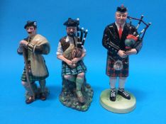 Three Royal Doulton figures 'The Laird' and two 'The Pipers' (3)
