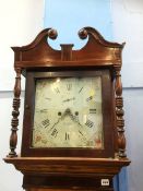 An oak long case clock by E Lowe, with painted dial, two subsidiary dials and 8 day movement