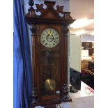 A walnut cased wall clock