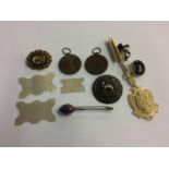 Assorted jewellery including a Victorian brooch, mother of pearl counters etc.