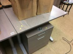 An office desk and filing drawers