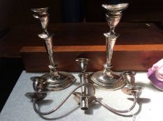 A pair of plated candelabra