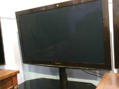 A Panasonic 3D television (remote in office)