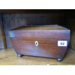 A mahogany tea caddy