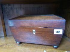 A mahogany tea caddy