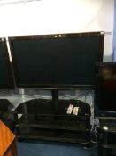 A Panasonic 3D television (remote in office)