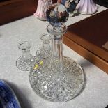 A Ship's decanter and a pair of candlesticks