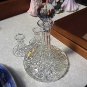 A Ship's decanter and a pair of candlesticks