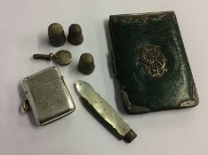 A silver Vesta, thimbles etc.