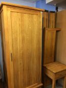 An oak wardrobe, bed ends and bedside table