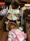 Two dolls and a chair