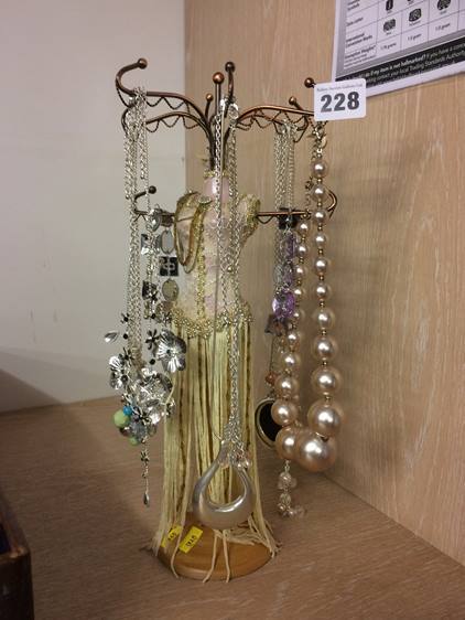 Quantity of costume jewellery and stand