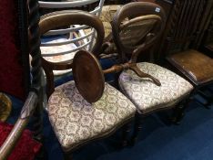 A pair of Victorian balloon back chairs