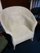 A white Lloyd Loom chair