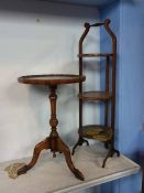 An Edwardian mahogany cake stand and an occasional table