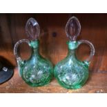 A pair of green flashed water jugs